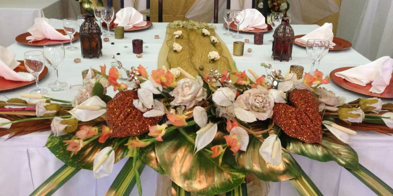 A gorgeous table displays with tropical flowers